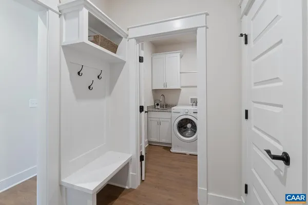a view of storage and utility room with washer and dryer