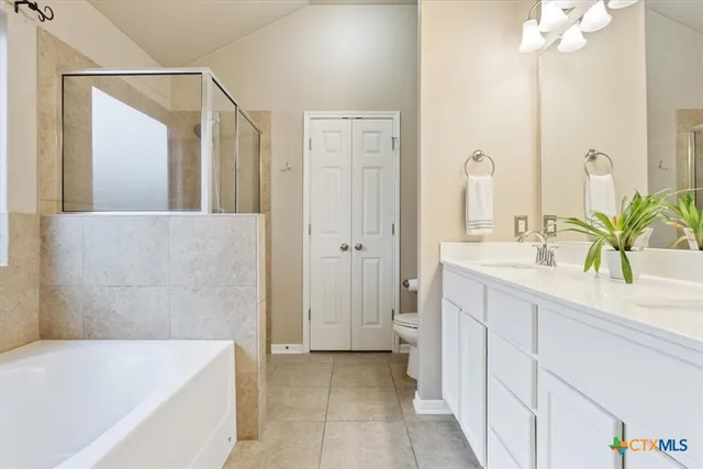 a bathroom with a glass shower door