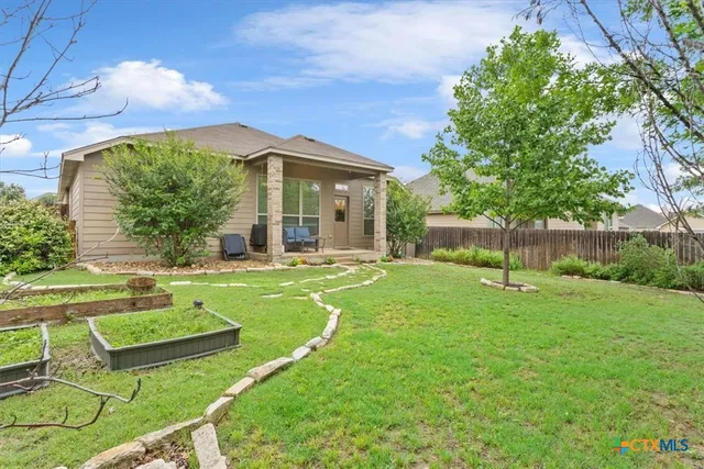 a swimming pool with lots of tress in front of it