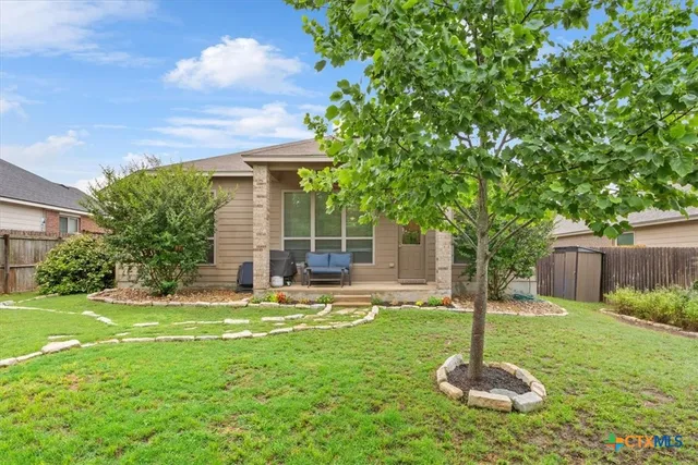 a view of a backyard with a trees