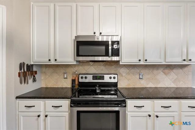 a kitchen with a sink and a refrigerator
