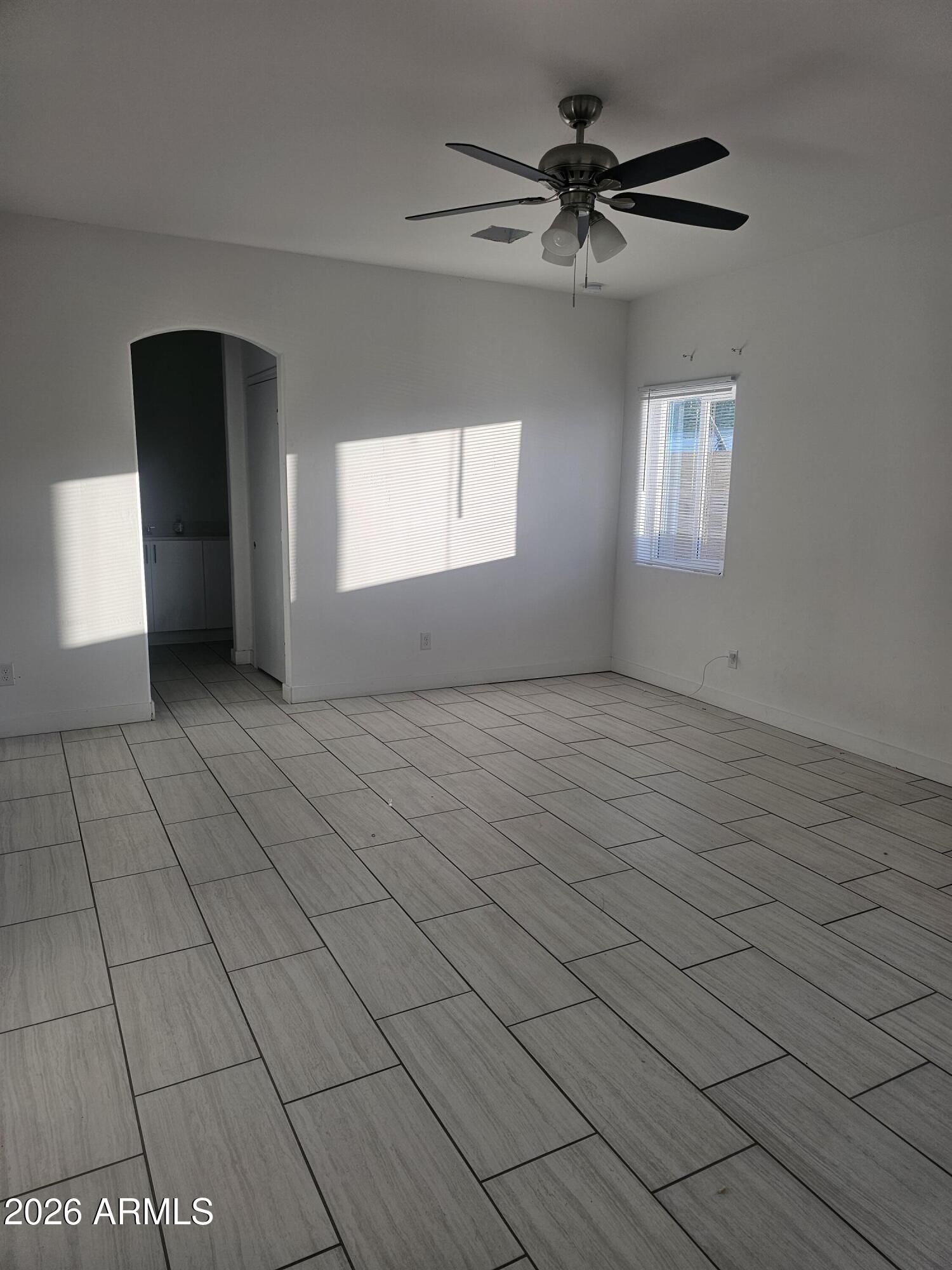 3021 West Almeria Road Phoenix, AZ 85009 - Photo 12 of 17 a view of an empty room with a window