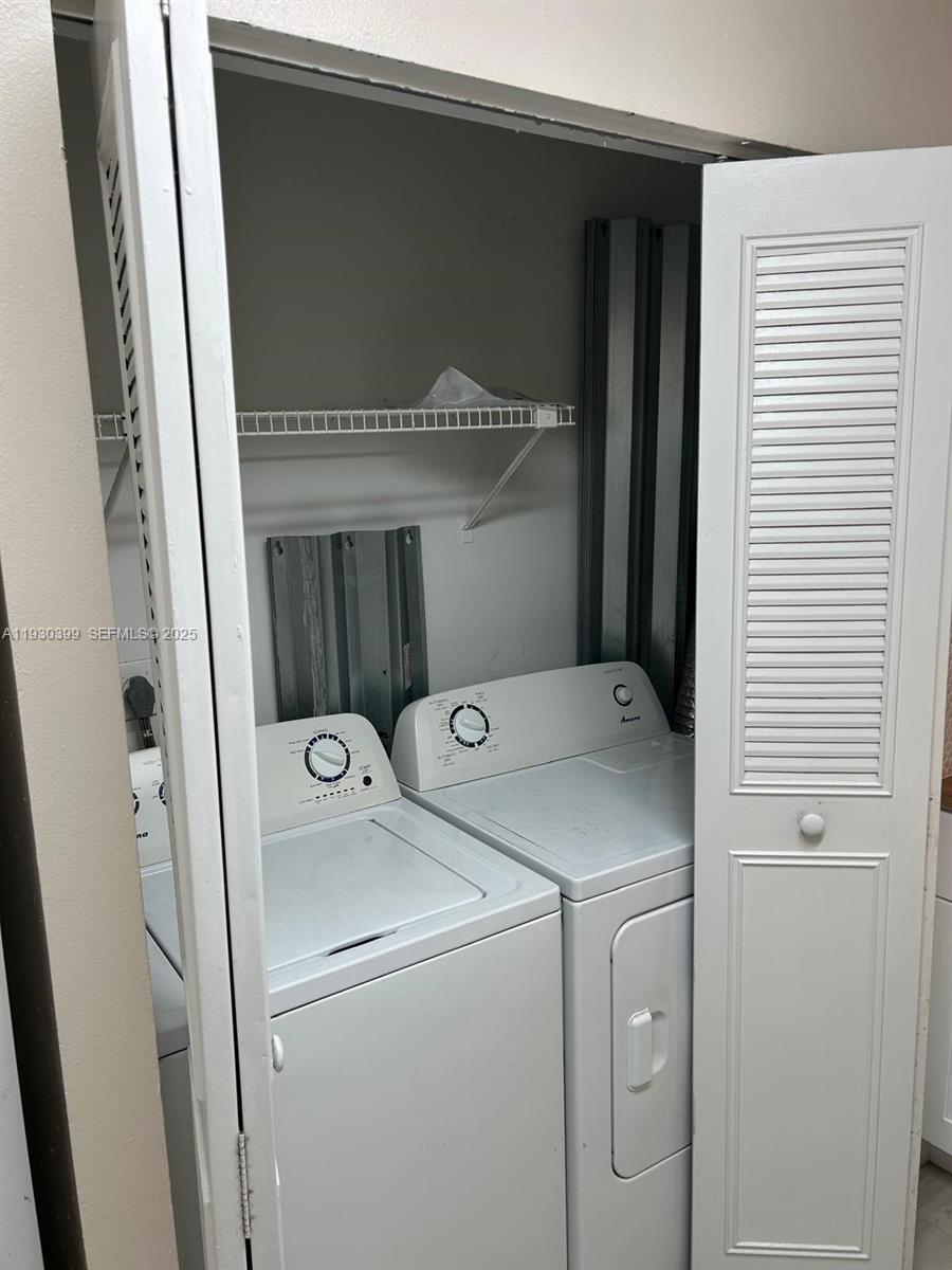 6292 Northwest 186th Street, Unit 214 Hialeah, FL 33015 - Photo 6 of 13 a utility room with dryer and washer