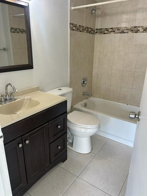 6292 Northwest 186th Street, Unit 214 Hialeah, FL 33015 - Photo 8 of 13 a bathroom with a sink a toilet and shower