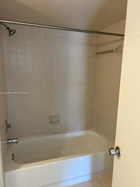 6292 Northwest 186th Street, Unit 214 Hialeah, FL 33015 - Photo 9 of 13 a bathroom with a shower and a bath tub