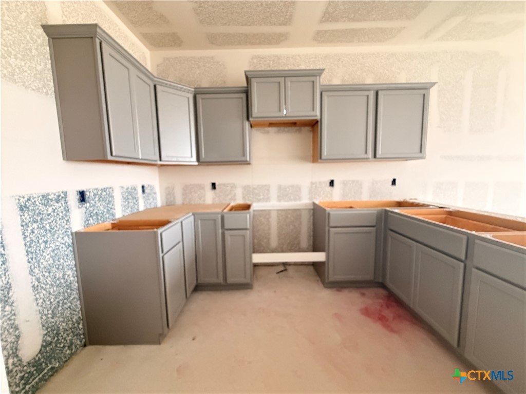 306 University Avenue Troy, TX 76579 - Photo 5 of 16 a kitchen with sink cabinets and window