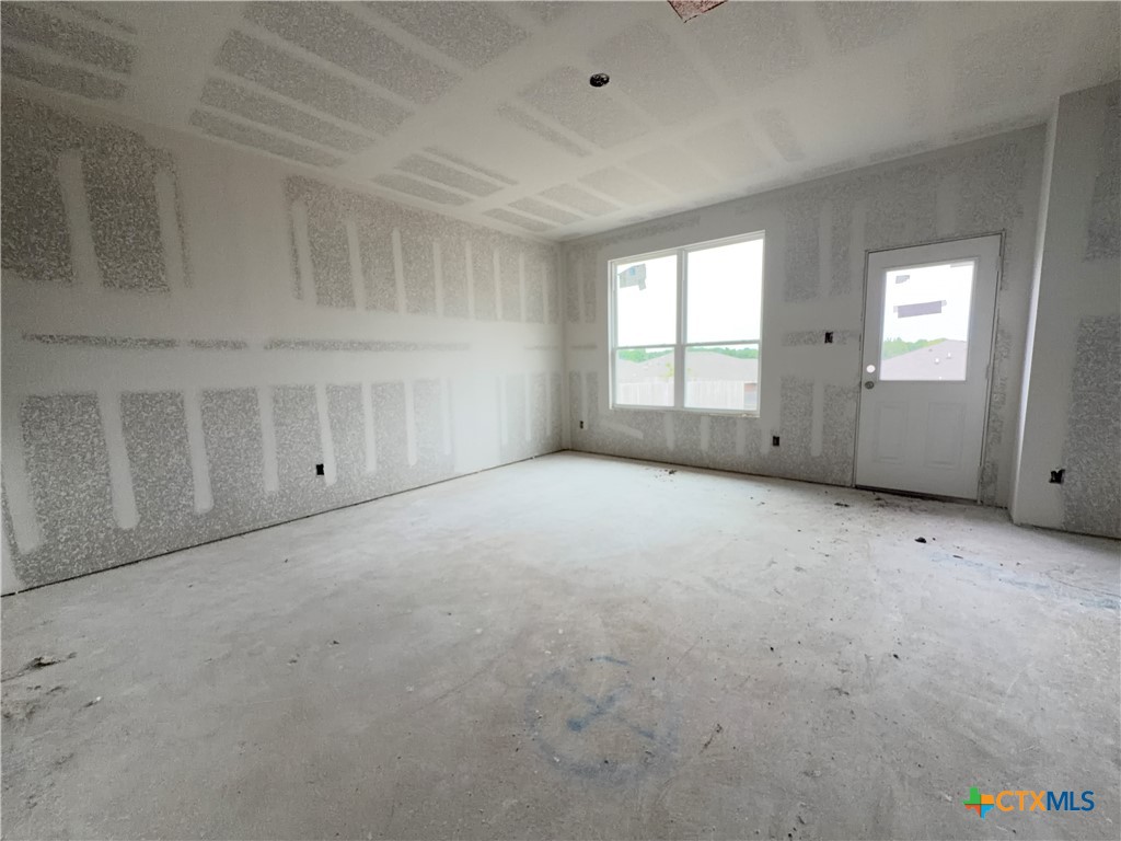 306 University Avenue Troy, TX 76579 - Photo 9 of 16 an empty room with a empty space and windows