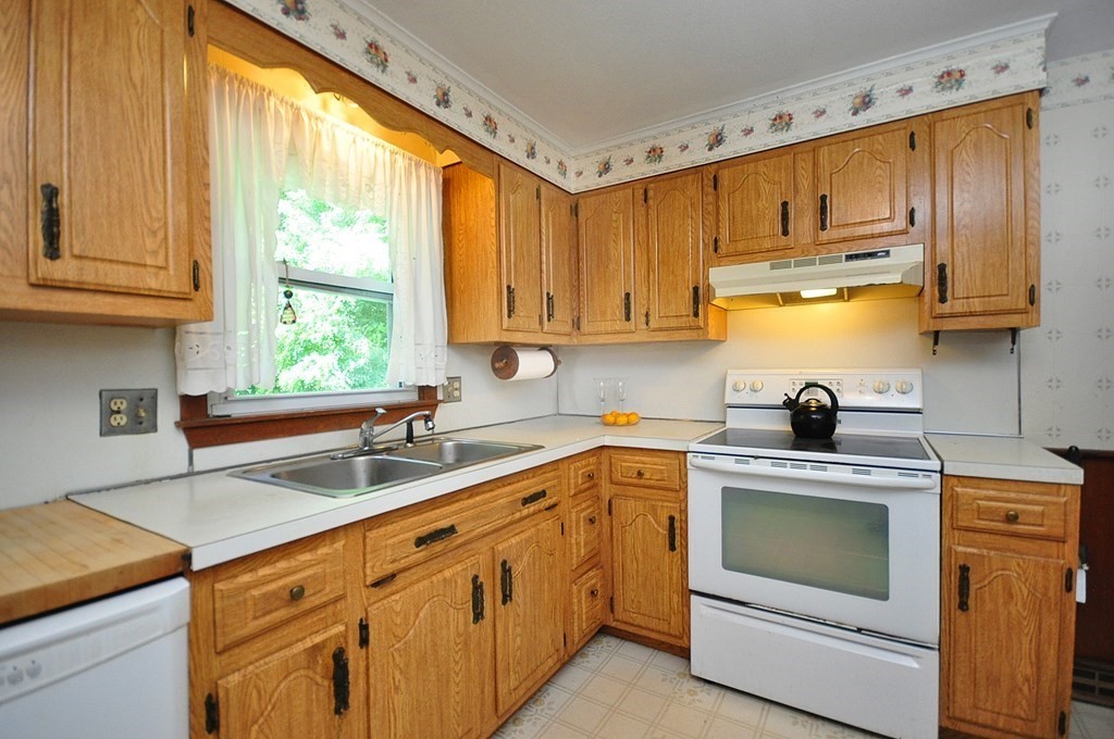 252 Sunrise Terrace Springfield, MA 01119 - Photo 11 of 41 a kitchen with a sink stove and cabinets