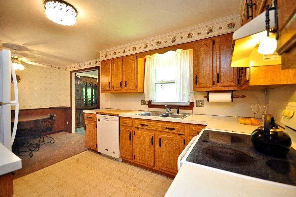 252 Sunrise Terrace Springfield, MA 01119 - Photo 12 of 41 a kitchen with a sink and a stove top oven