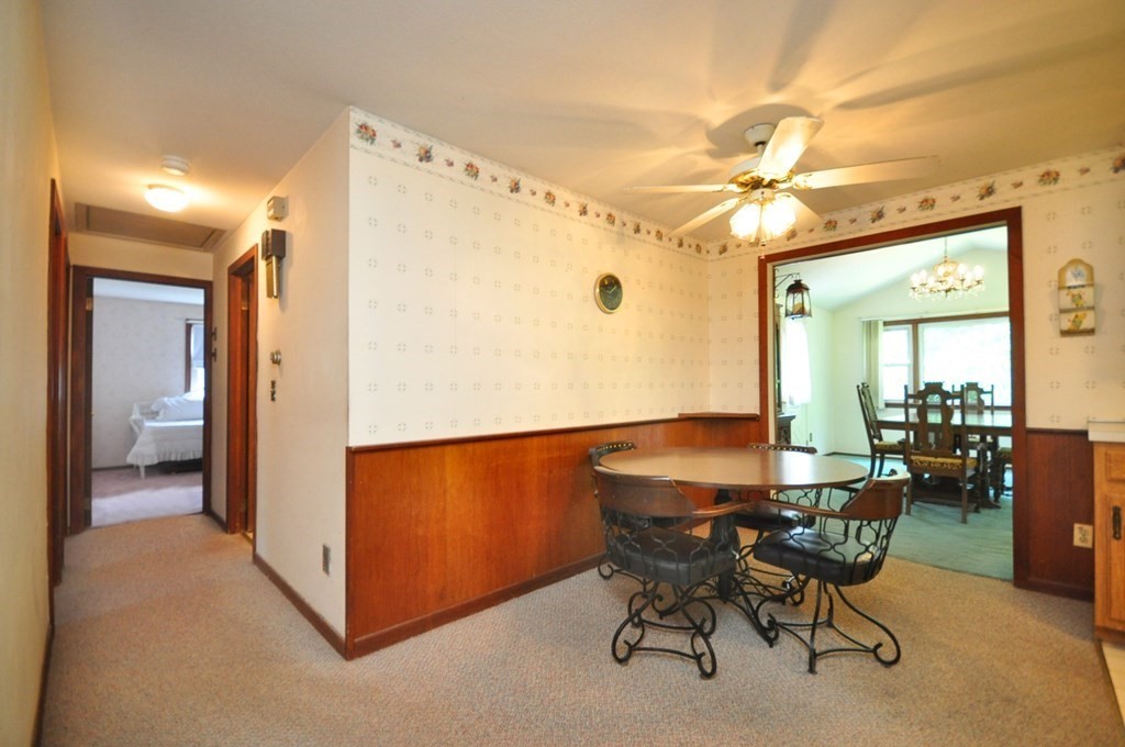 252 Sunrise Terrace Springfield, MA 01119 - Photo 18 of 41 a view of a dining room with furniture and a chandelier