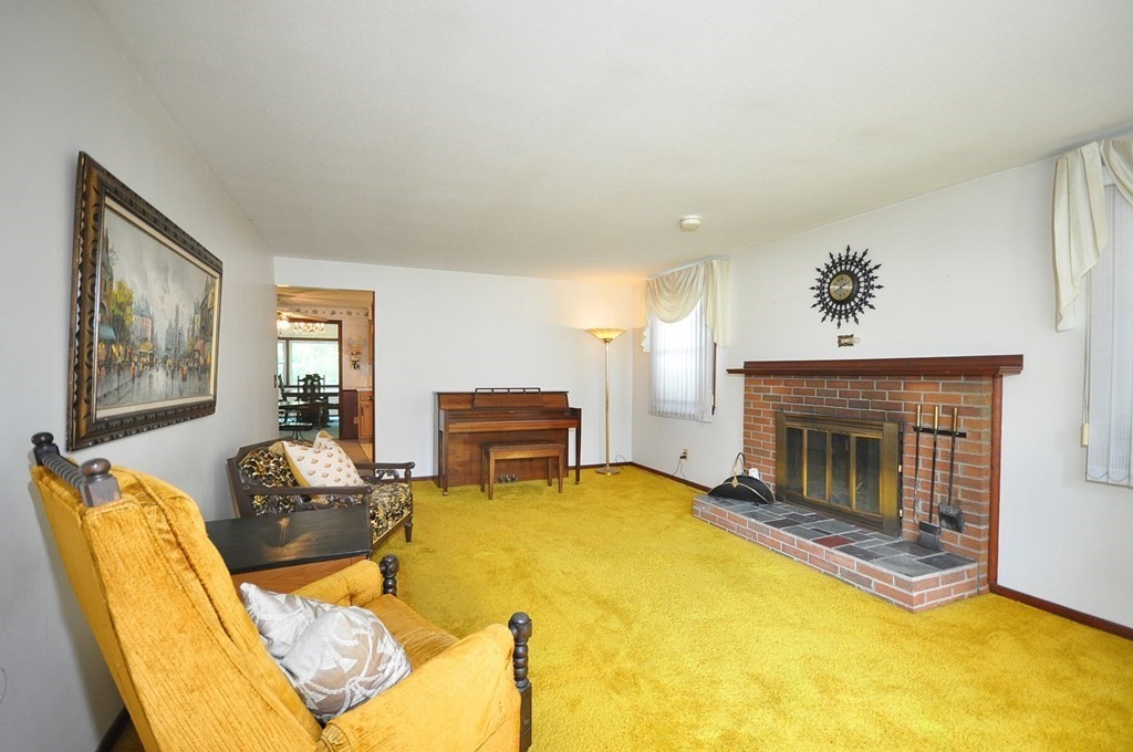 252 Sunrise Terrace Springfield, MA 01119 - Photo 3 of 41 a living room with furniture and a fireplace