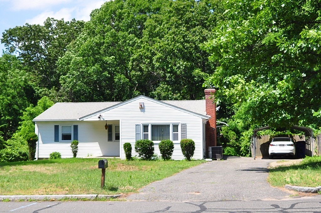 252 Sunrise Terrace Springfield, MA 01119 - Photo 40 of 41 a front view of a house with a garden and yard