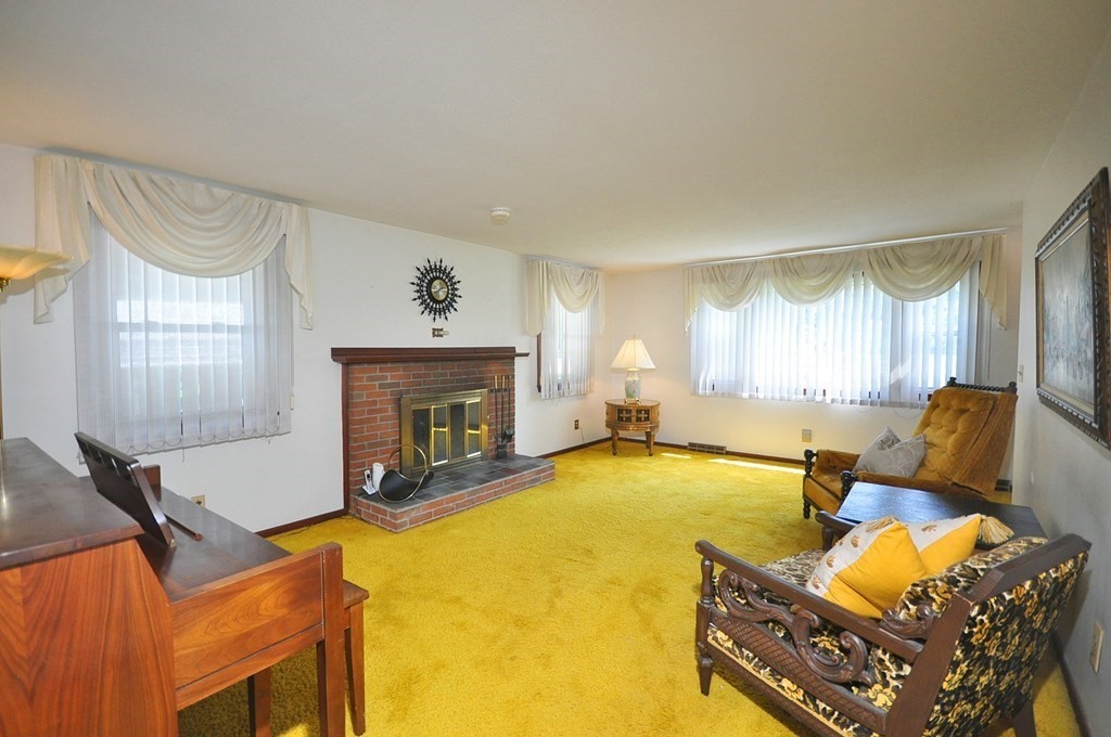 252 Sunrise Terrace Springfield, MA 01119 - Photo 5 of 41 a living room with furniture and a fireplace