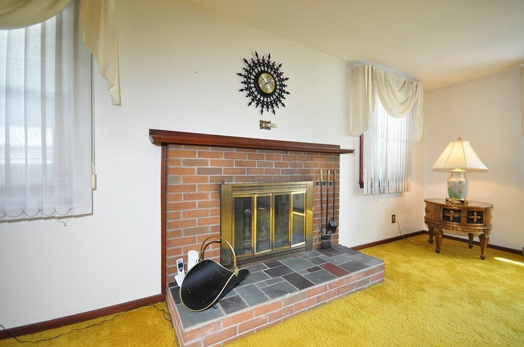 252 Sunrise Terrace Springfield, MA 01119 - Photo 6 of 41 a living room with furniture and a fireplace