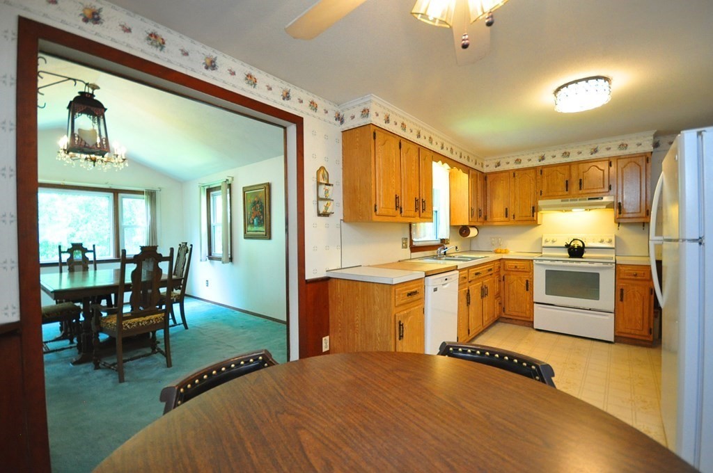 252 Sunrise Terrace Springfield, MA 01119 - Photo 9 of 41 a kitchen with a sink appliances and a dining table