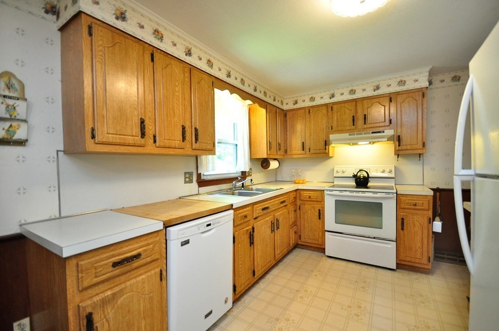 252 Sunrise Terrace Springfield, MA 01119 - Photo 10 of 41 a kitchen with stainless steel appliances granite countertop a stove a sink and a refrigerator