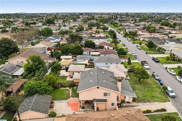 an aerial view of residential houses with outdoor space