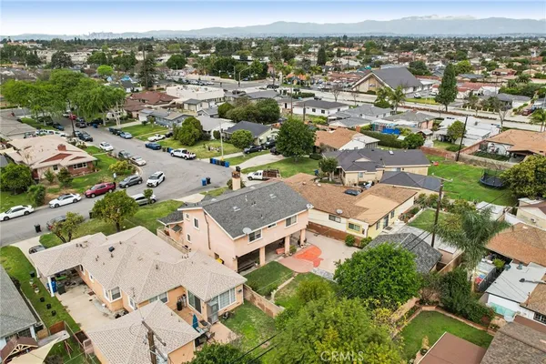 an aerial view of a house with a lake view