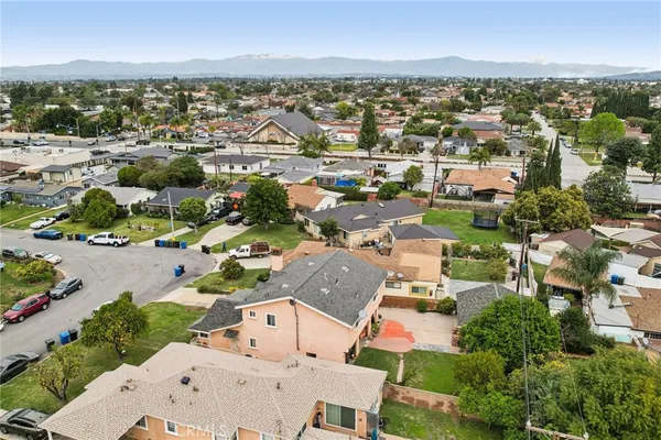 an aerial view of residential houses with outdoor space