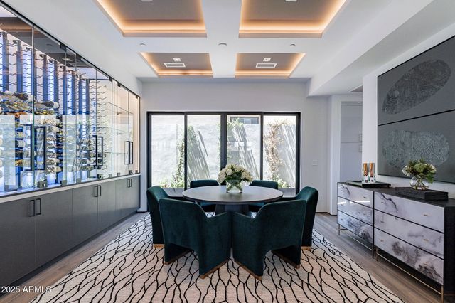 a dining room with furniture and wooden floor