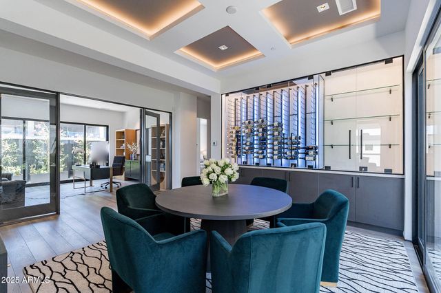 a dining room with furniture and wooden floor