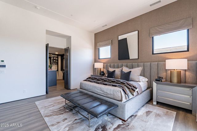 a bedroom with a bed and a couch