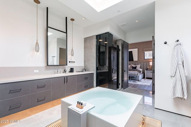 a large kitchen with a table and chairs