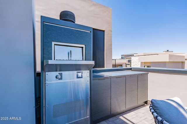 a kitchen with a cabinets and a stove top oven