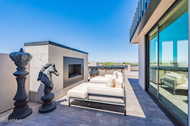 a bedroom with furniture and a wooden floor