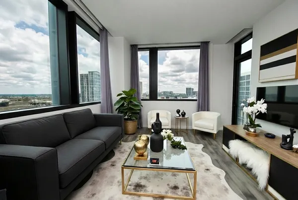 a living room with furniture and a large window