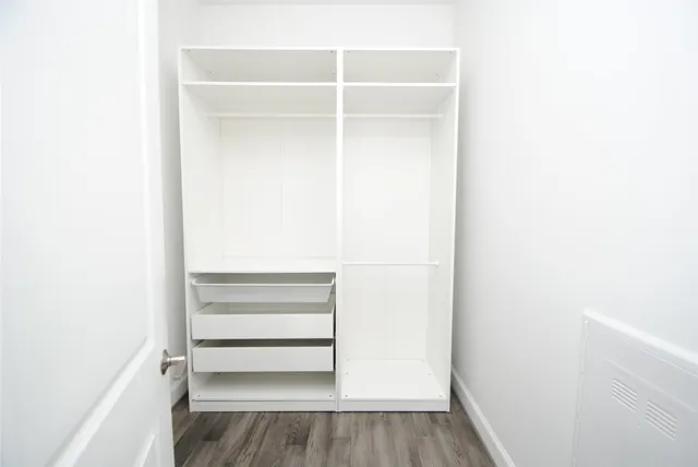 a view of an empty walk in closet
