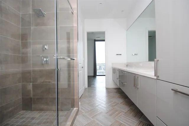 a bathroom with a sink and shower