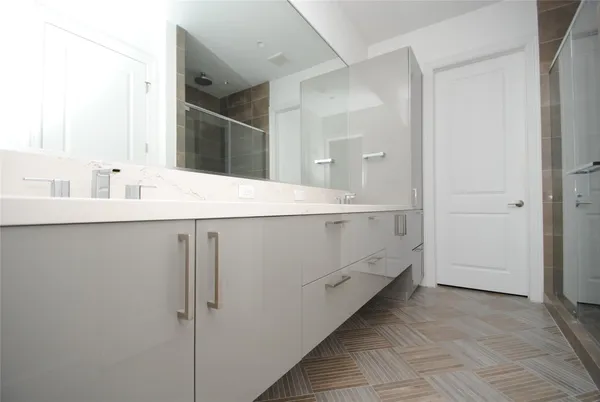 a room with a sink and a mirror