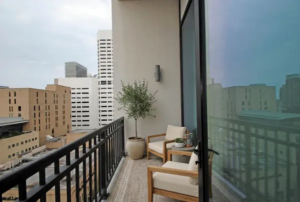 a view of balcony with a potted plant