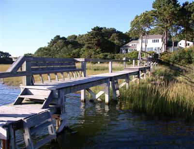 Undisclosed Address Cotuit, MA 02635 - Photo 4 of 7 a balcony with tall trees