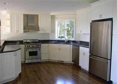 Undisclosed Address Cotuit, MA 02635 - Photo 5 of 7 a kitchen with a sink stove and refrigerator