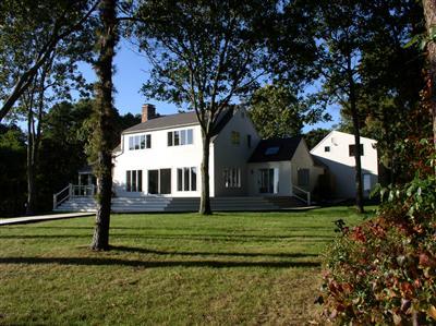 Undisclosed Address Cotuit, MA 02635 - Photo 7 of 7 a front view of a house with a yard