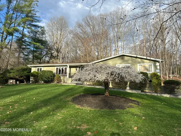 a bedroom with furniture and window