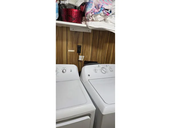 a utility room with dryer and washer
