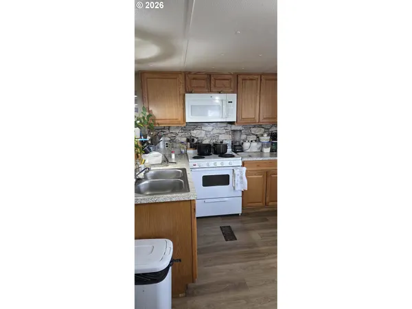a kitchen with a sink and a stove