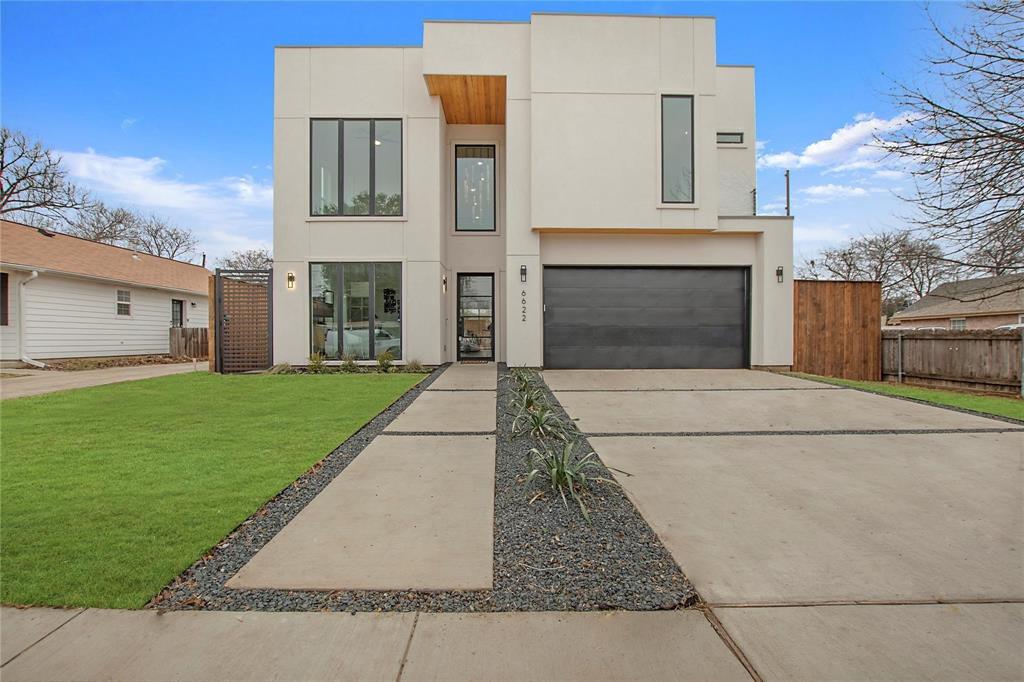 6622 Tyree Street Dallas, TX 75209 - Photo 1 of 1 Contemporary house with stucco siding, a garage, and driveway