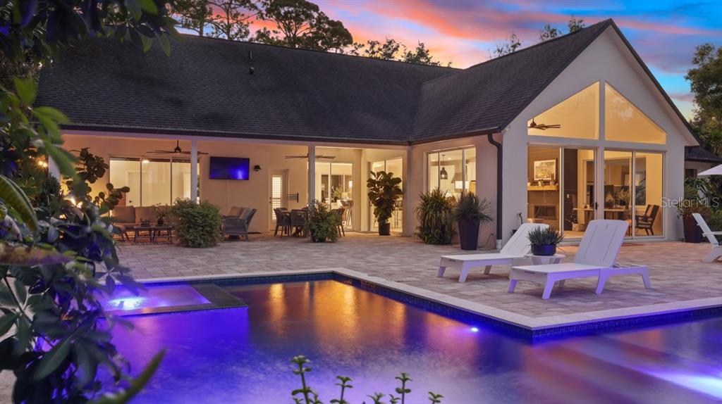 4733 Chuluota Road Orlando, FL 32820 - Photo 29 of 46 a view of a house with swimming pool and porch with furniture