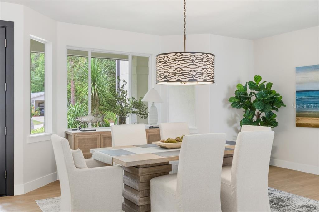 4733 Chuluota Road Orlando, FL 32820 - Photo 7 of 46 a view of a dining room with furniture window and outside view