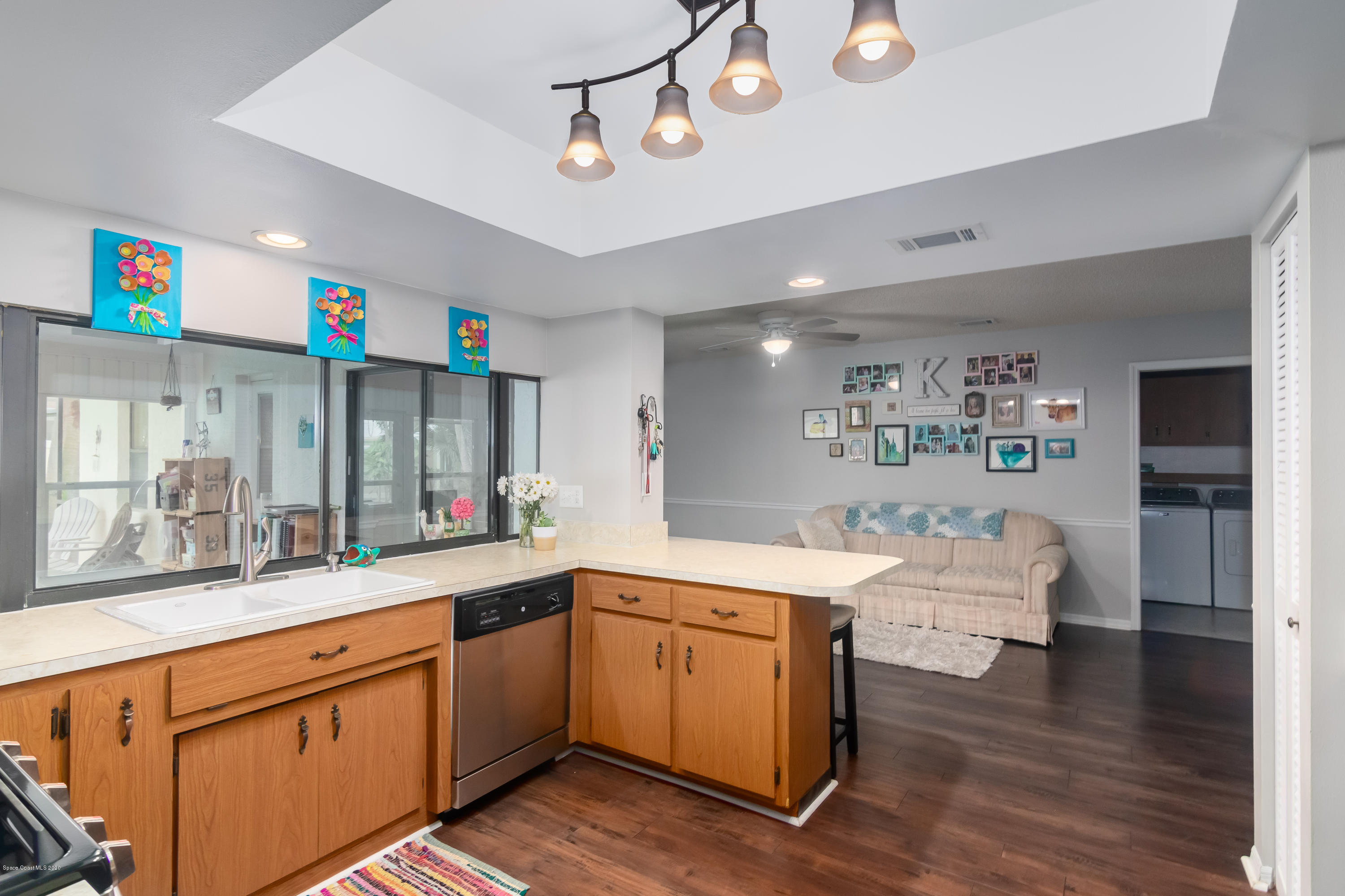 439 Winchester Road Satellite Beach, FL 32937 - Photo 10 of 29 Kitchen & Family Room