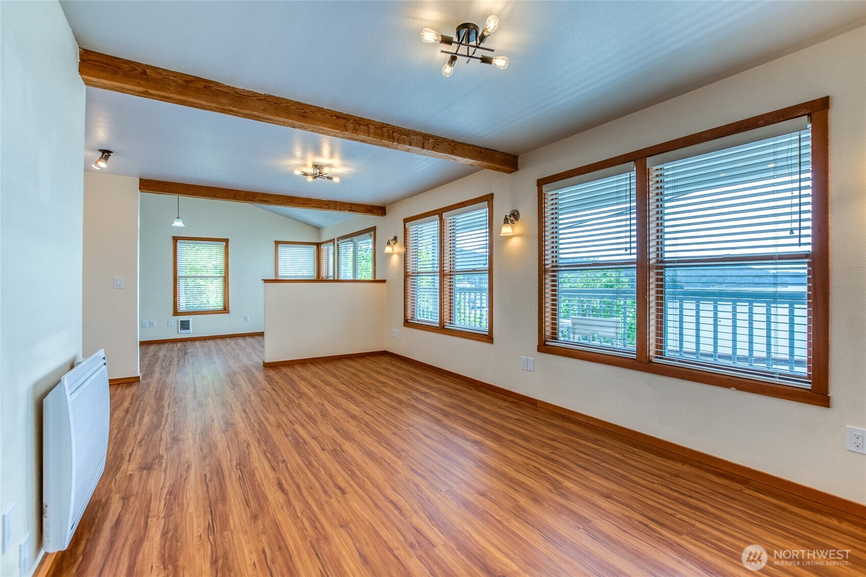 942 Deer Harbor Road Orcas Island, WA 98245 - Photo 7 of 40 a view of an empty room with wooden floor and a window