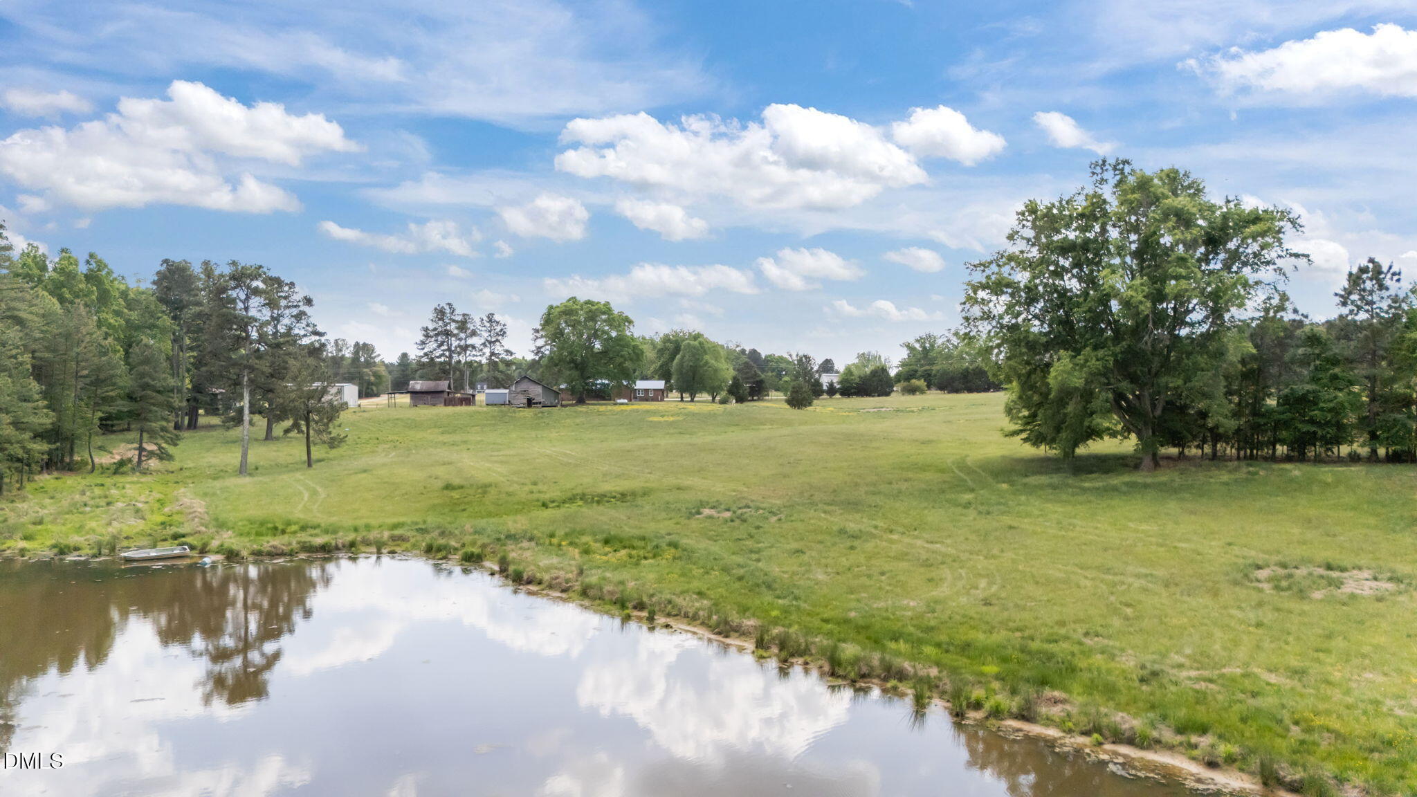 3611 Chewning Road Oxford, NC 27565 - Photo 22 of 45 a view of a lake with a yard