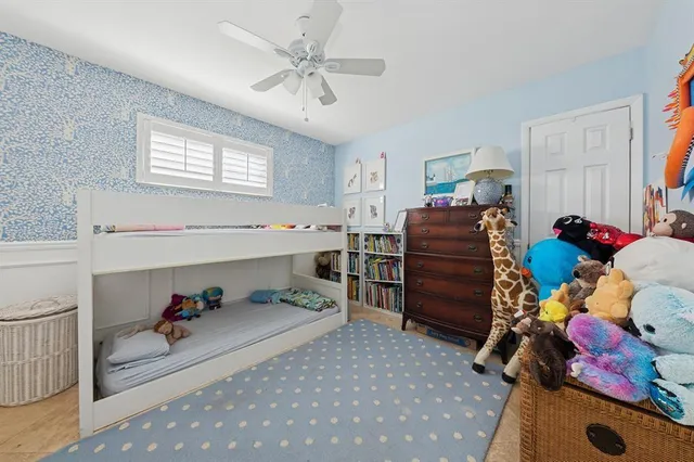 a bed room with a bed and a window