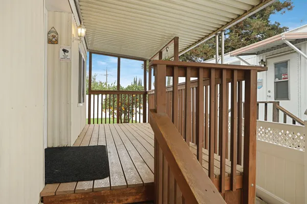 a view of balcony with wooden floor