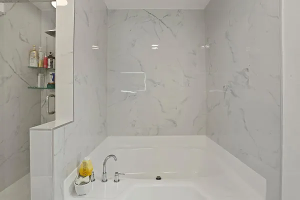 a close view of a bathtub in bathroom