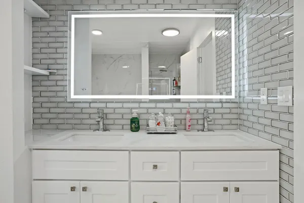 a bathroom with a sink and a mirror
